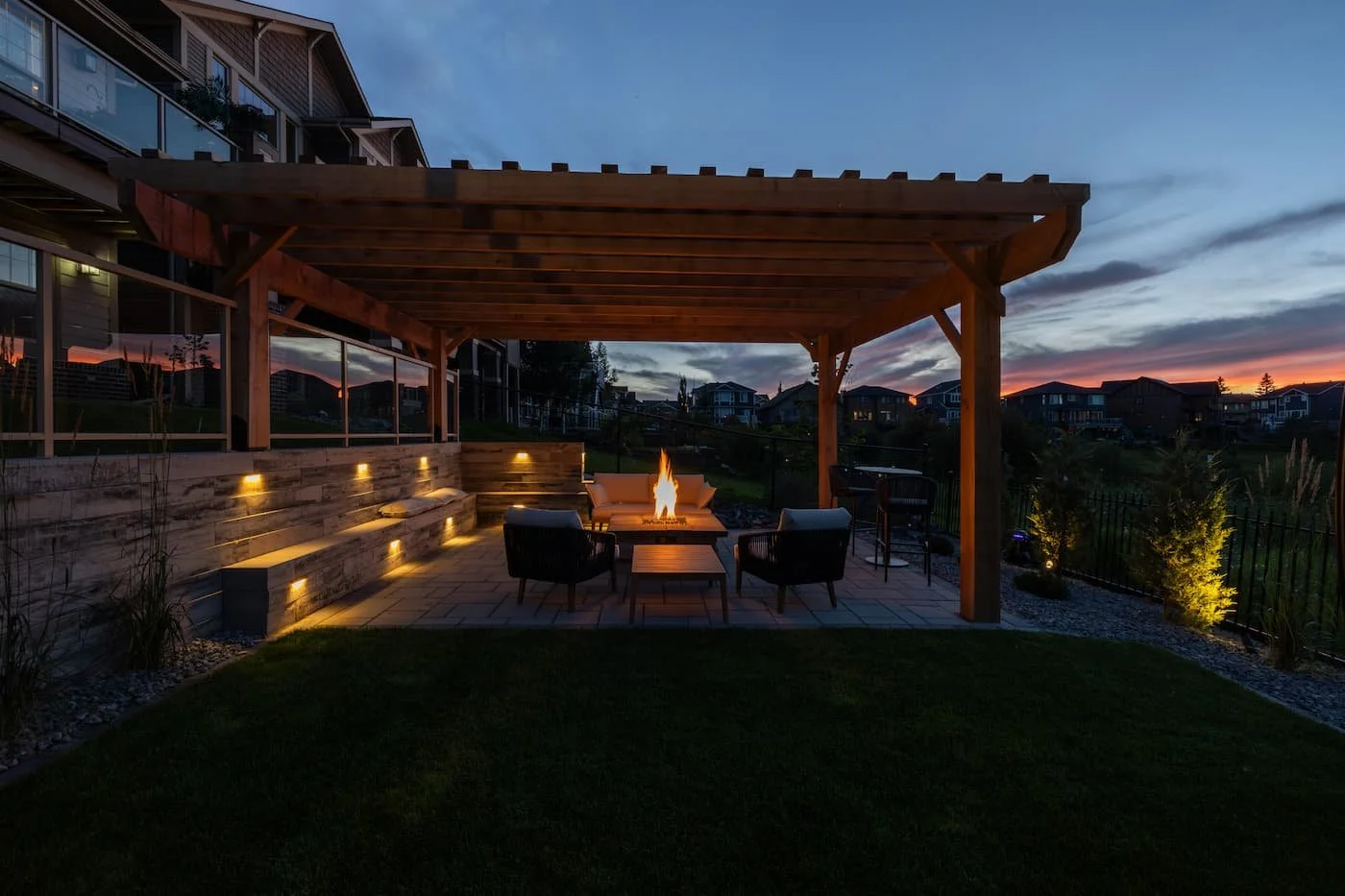 Outdoor pergola and firepit with built in lighting