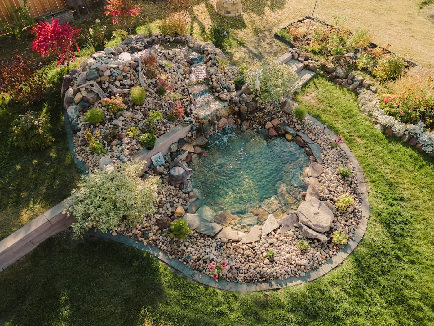 Large pond with a flowing stream and natural surrounding