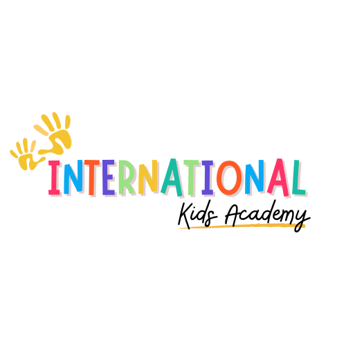 Colorful 3D text spelling 'INTERNATIONAL' with a yellow banner behind it and a brown rectangle at the bottom, likely a poster or sign.
