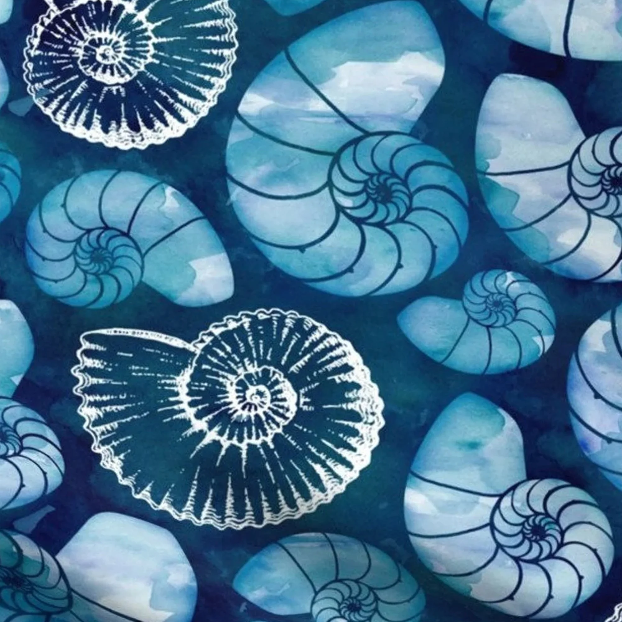A dark blue fabric with white and light blue ammonite fossils. The fabric is used on the front of the messenger bags.