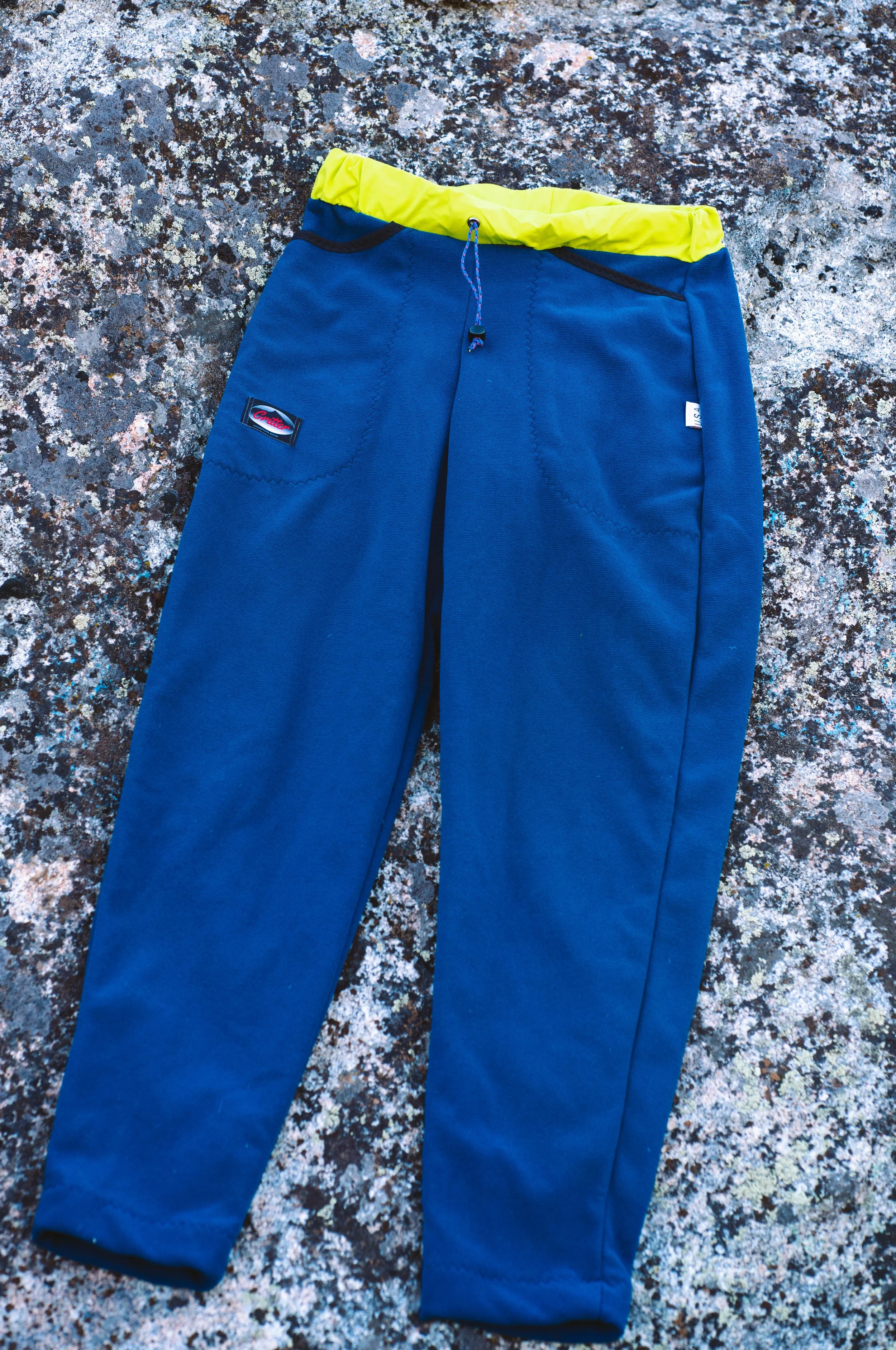 The front of a pair of Polartec Critter Pants showing the waistband.