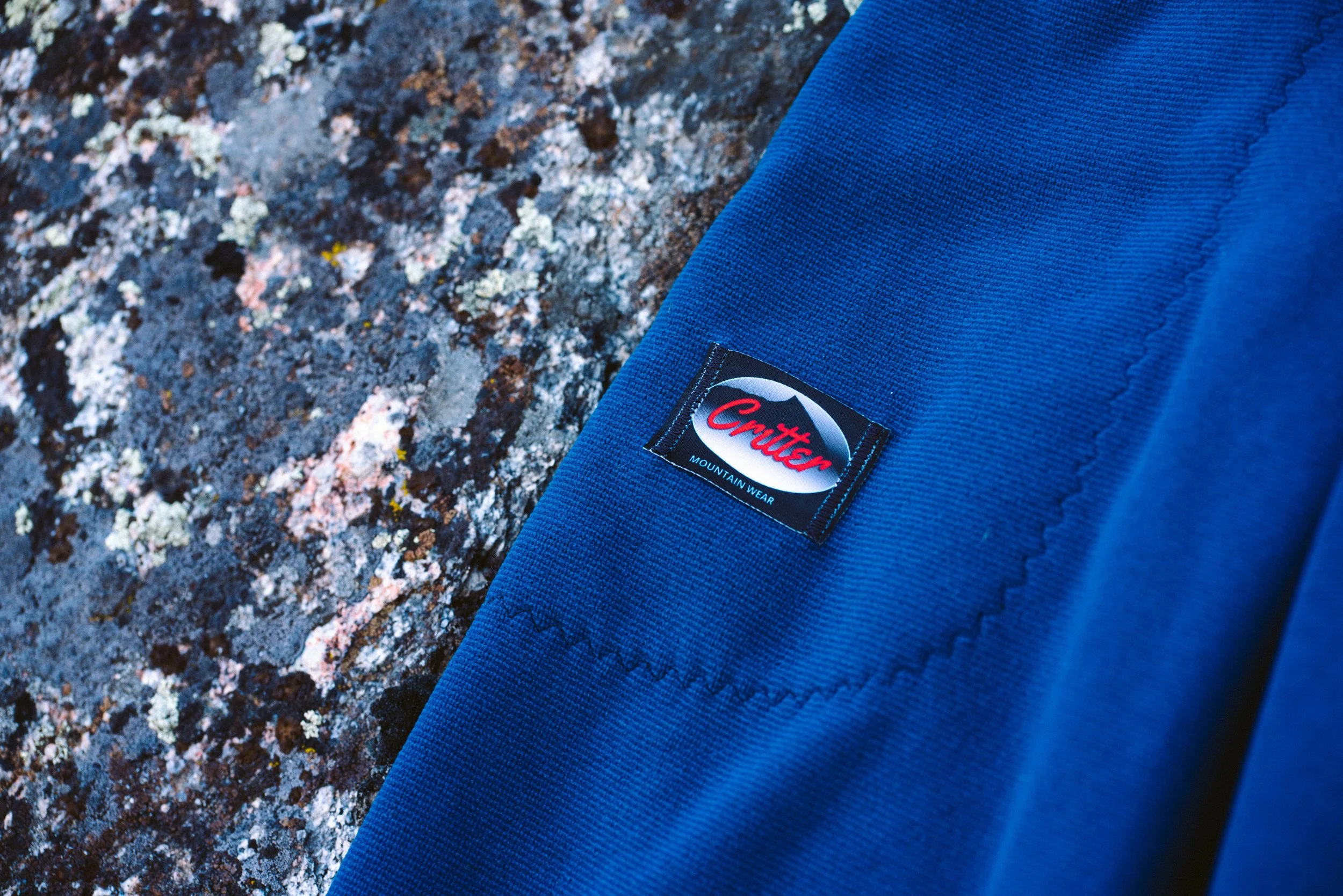 A pair of Polartec Critter Pants showing the front pockets and a Critter logo label.