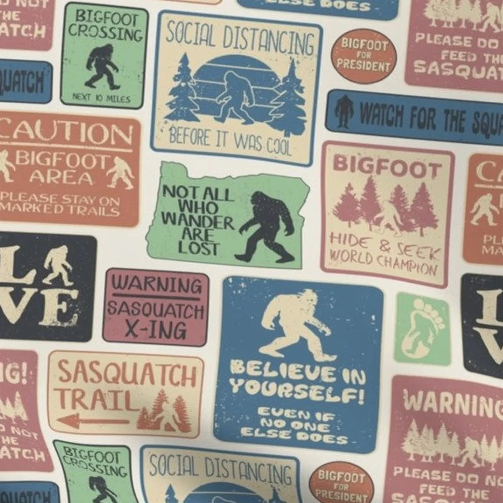 An earth tone, multi-colored fabric with different messages about Bigfoot and Sasquatch.