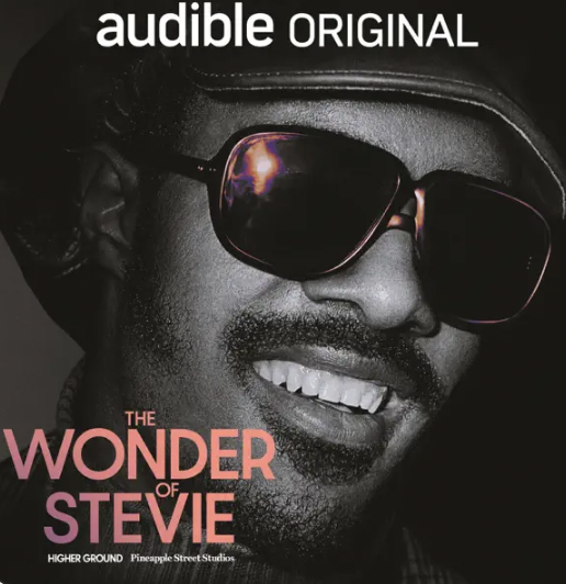 Cover art for Audible Original titled 'The Wonder of Stevie' showing a smiling man wearing sunglasses and a hat.