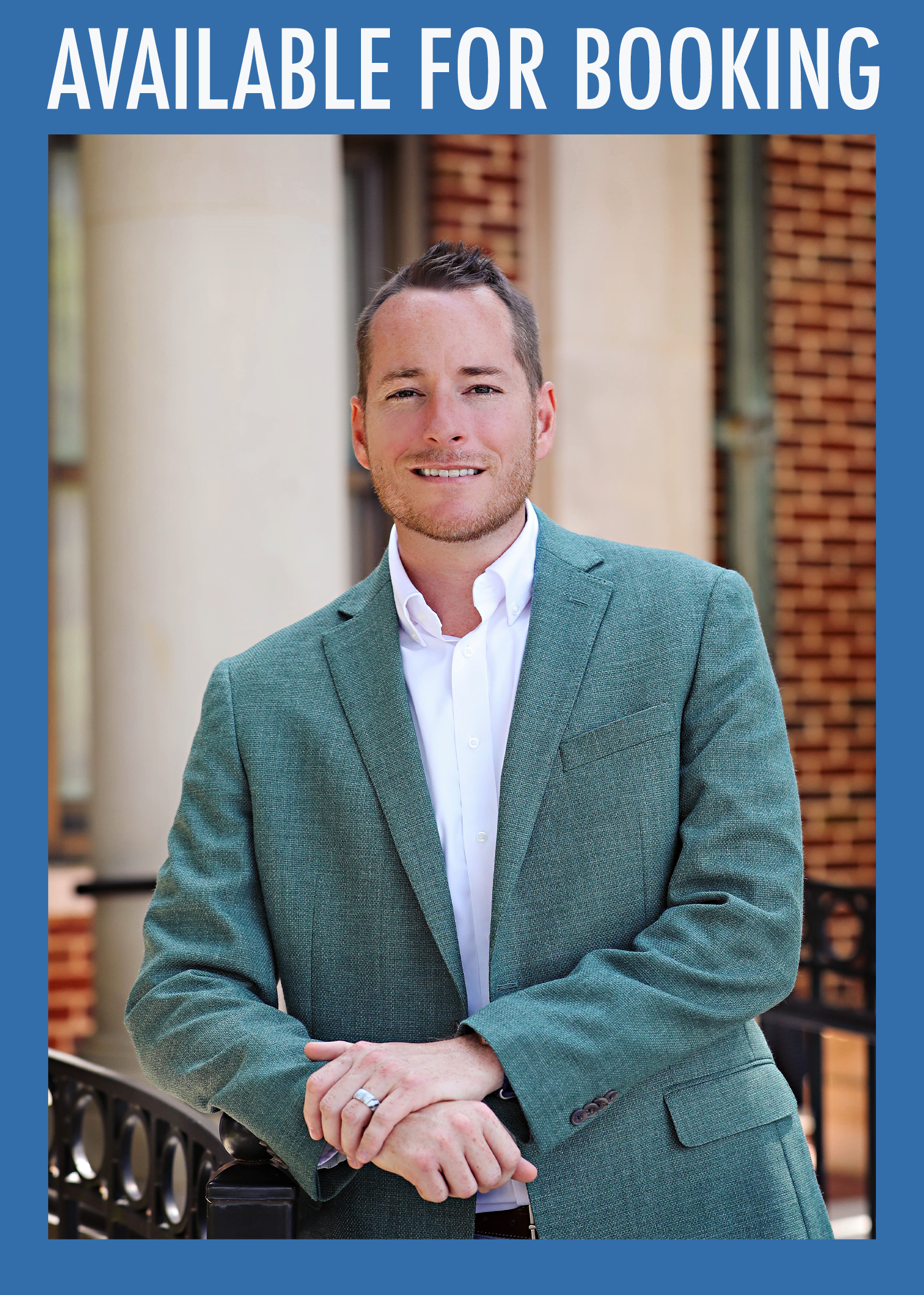 A promotional poster with the text 'Available for Booking' at the top, featuring a man in a teal blazer and white shirt standing outdoors in front of a brick building. Dr. Matthew Hammett