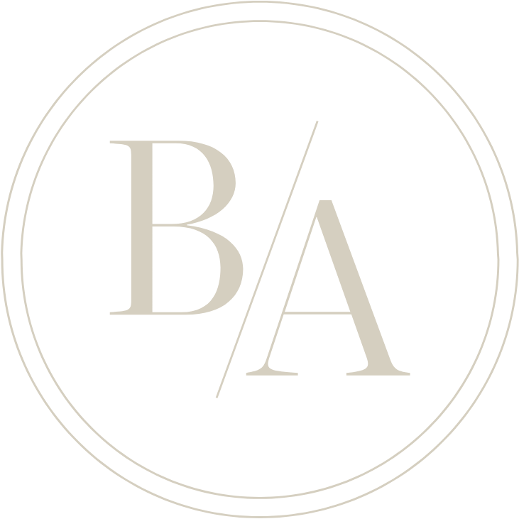Circle logo with the letters B and A separated by a diagonal slash on a black background.