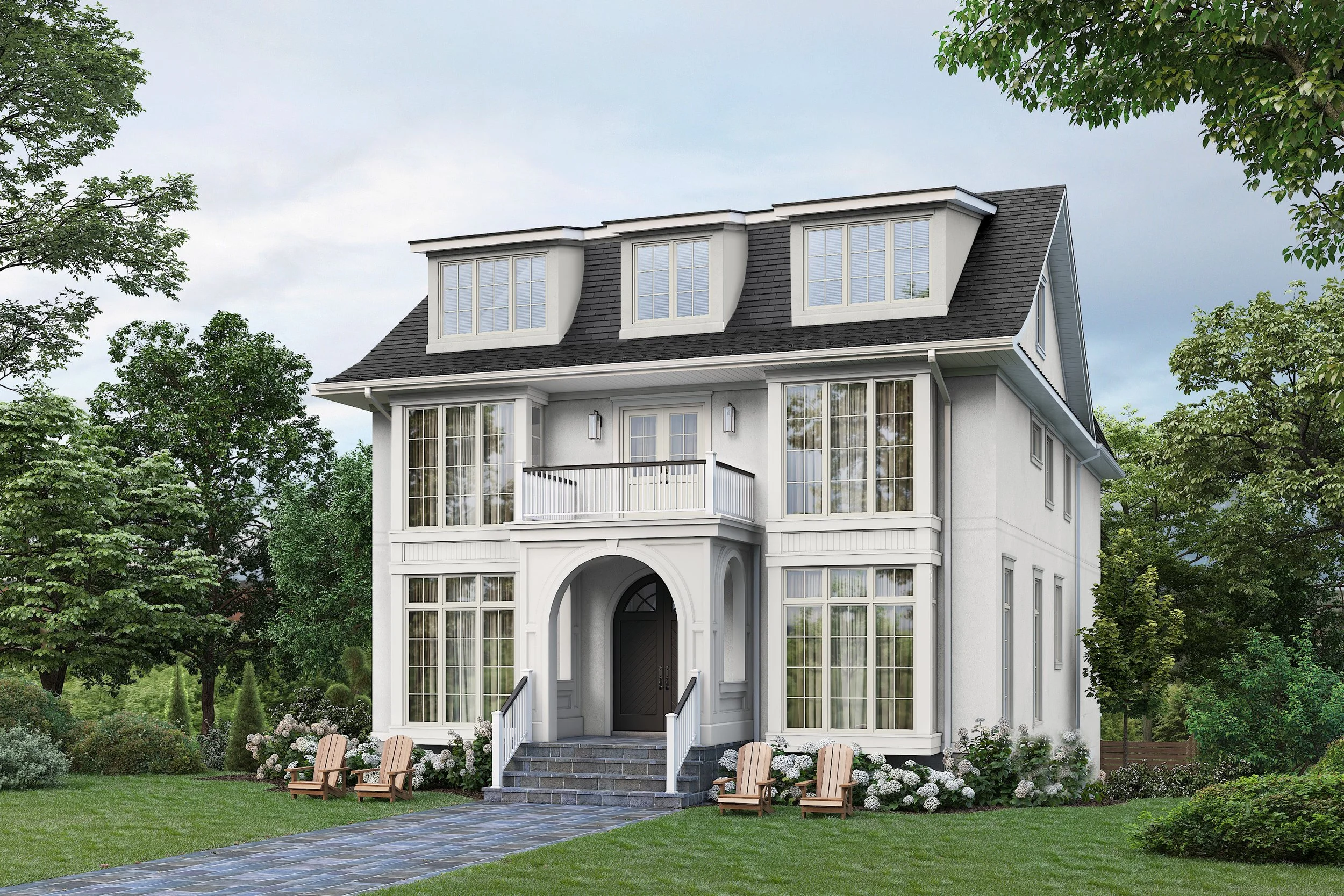 A large white house with multiple stories, many large windows, and a steep roof with dormer windows, surrounded by green trees and a well-maintained lawn with garden chairs.