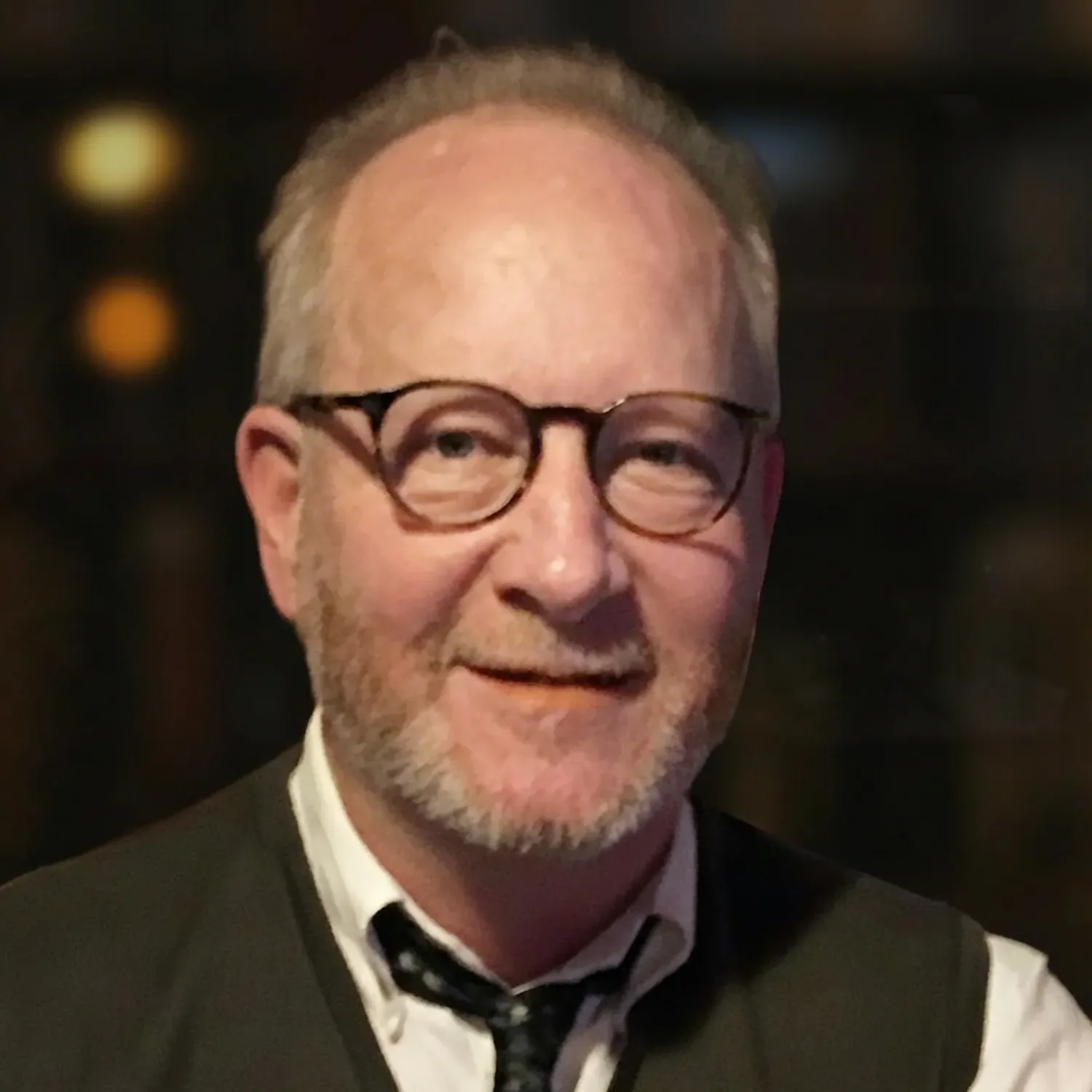 Silhouette of a person's head and shoulders against a light purple background.