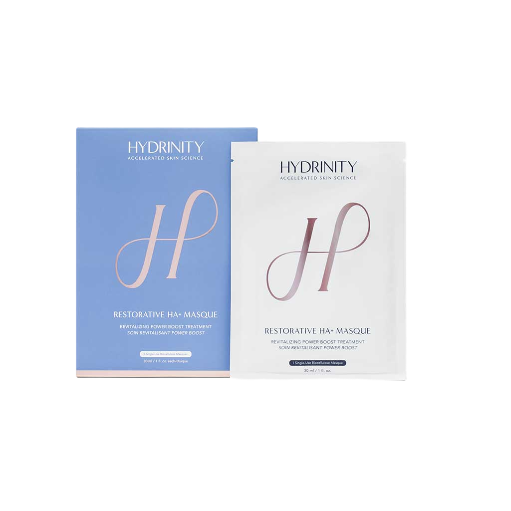 Two skincare product packages from Hydrinity, one blue and one white, labeled 'Restorative HA+ Masque' with descriptions of revitalizing power boost treatment.