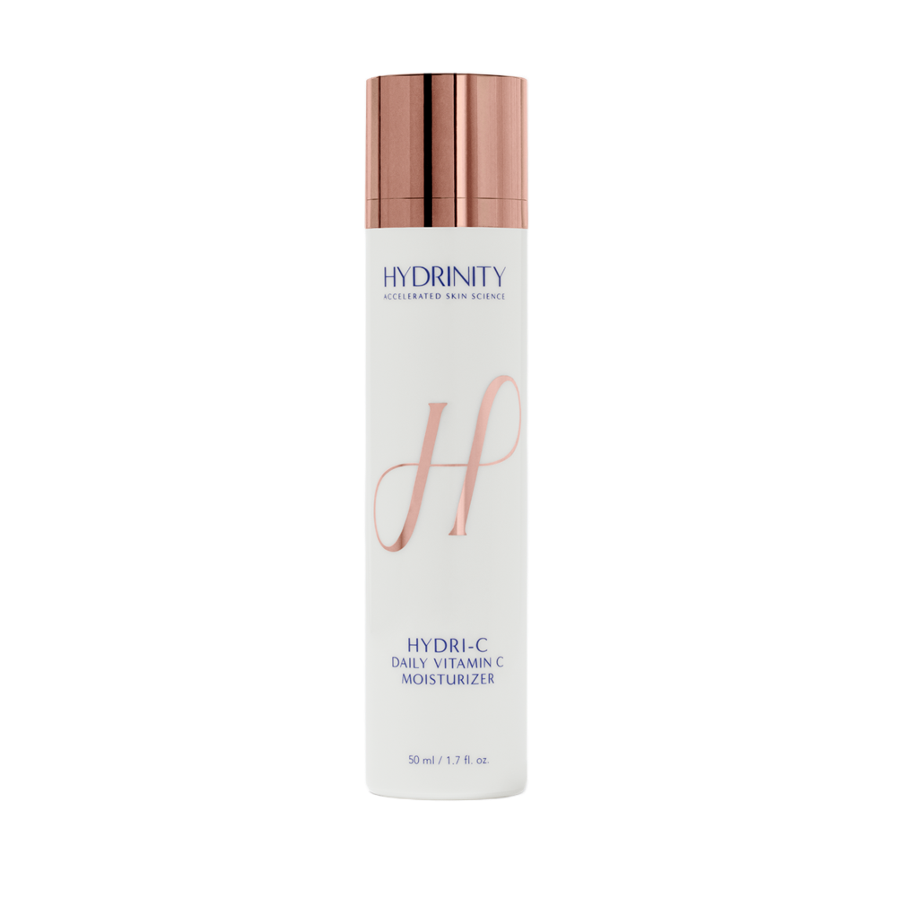 A white cylindrical bottle of Hydrinity Hydra-C Daily Vitamin C Moisturizer with a rose gold cap.