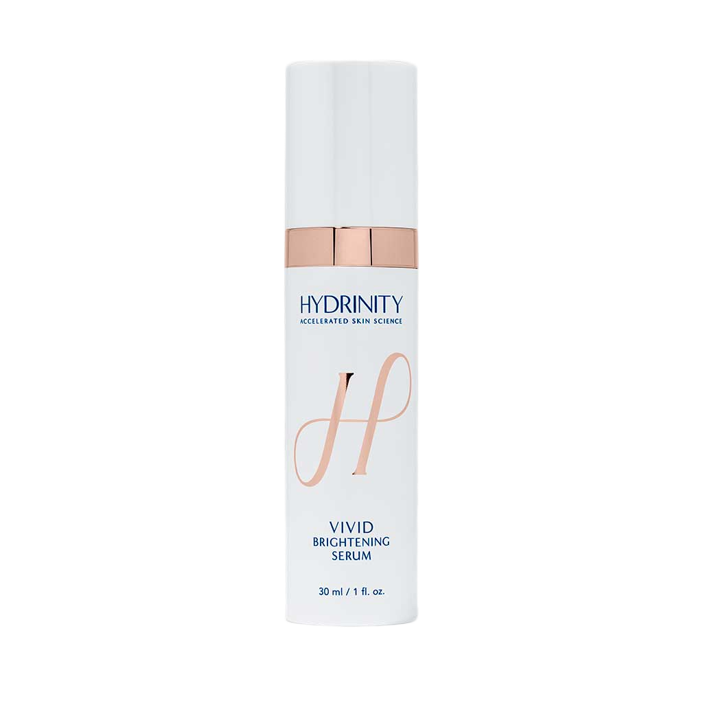 A white bottle with a light pink cap and accents. The label reads "HYDRINITY Accelerated Skin Science" and "Vivid Brightening Serum," indicating it is a skincare product containing 30 ml or 1 fluid ounce.