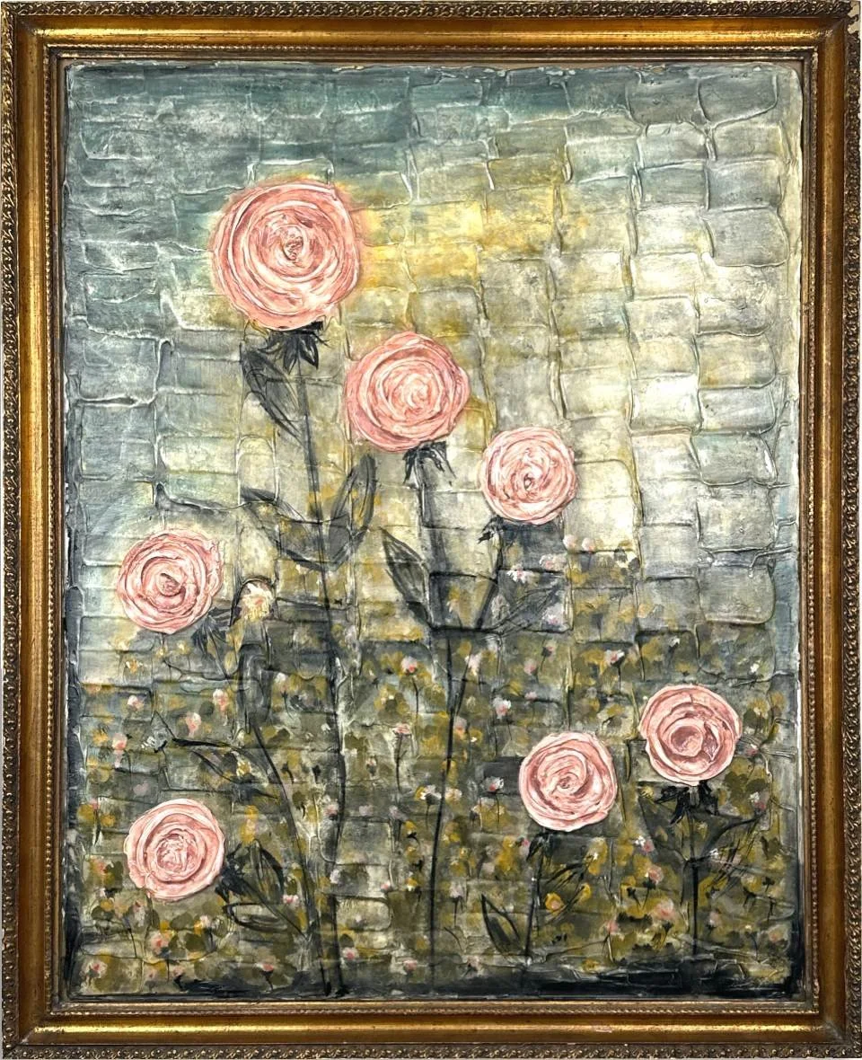 A painting of pink roses with black stems and leaves against a textured, abstract background that resembles a brick wall. The painting is framed in an ornate gold frame.