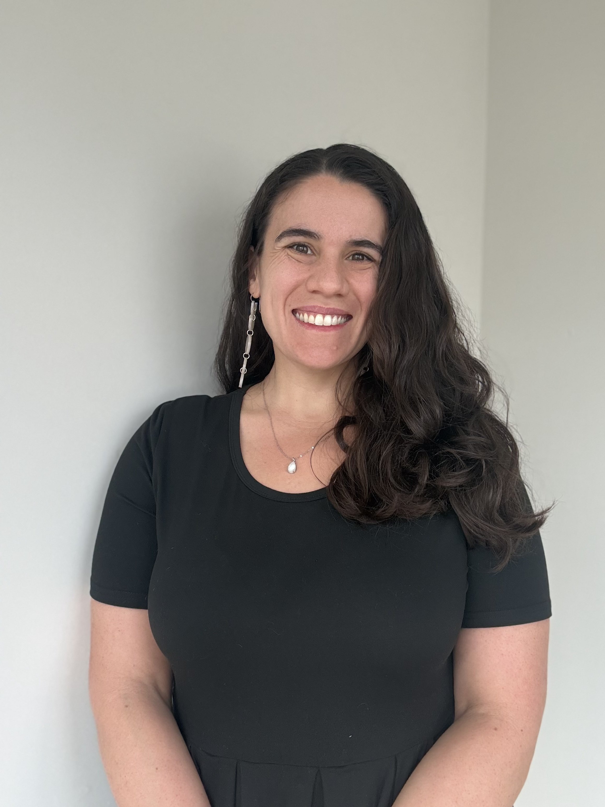 Amanda Kenney smiling wearing black dress