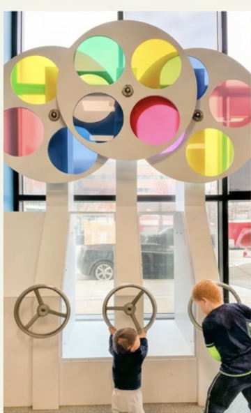 Children playing with interactive science exhibits at Experimentarium Copenhagen.