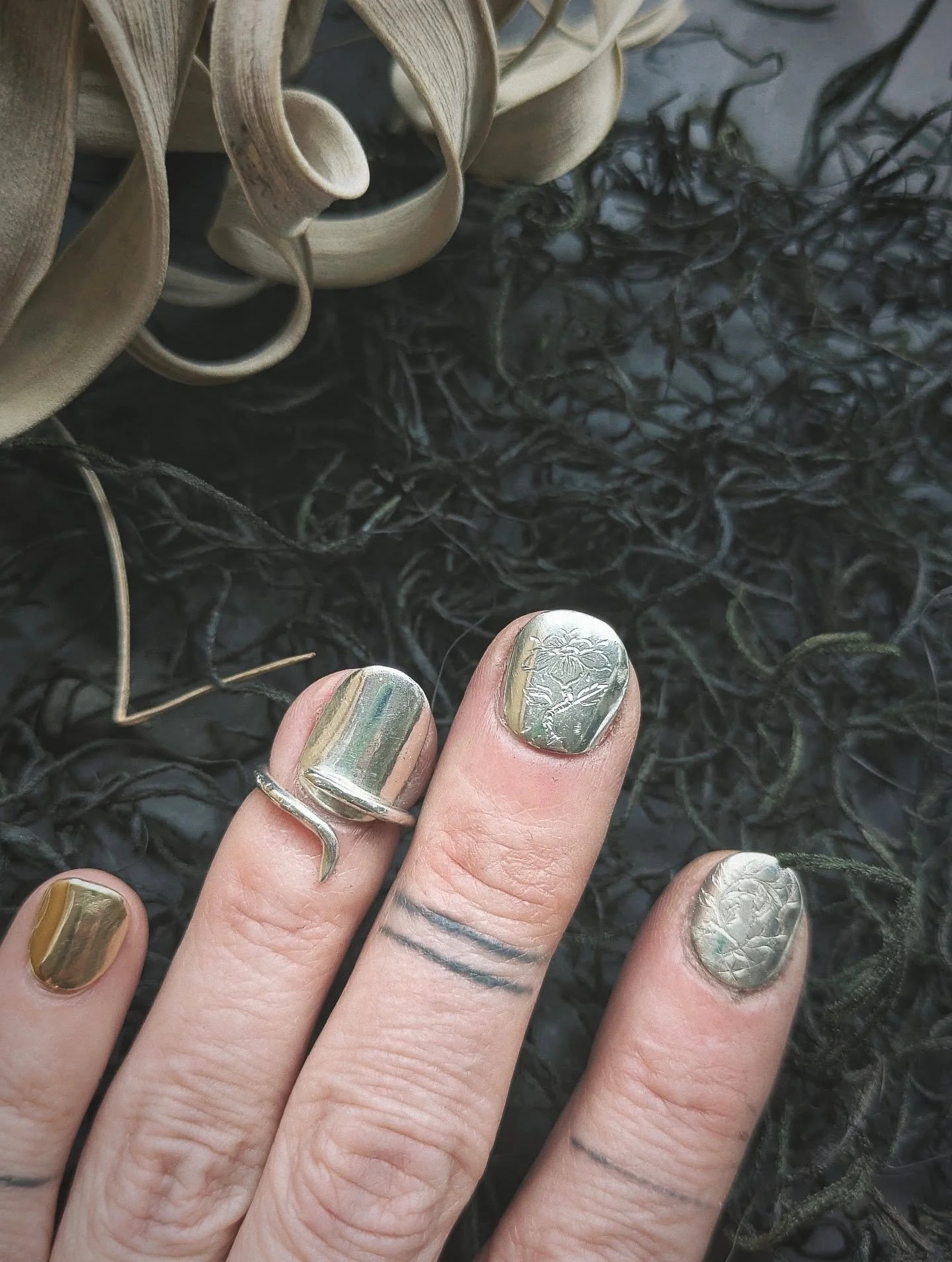 Engraving my nails. Ignore my garbage hands. Probably should've started with a not scratched up surface, but why?!