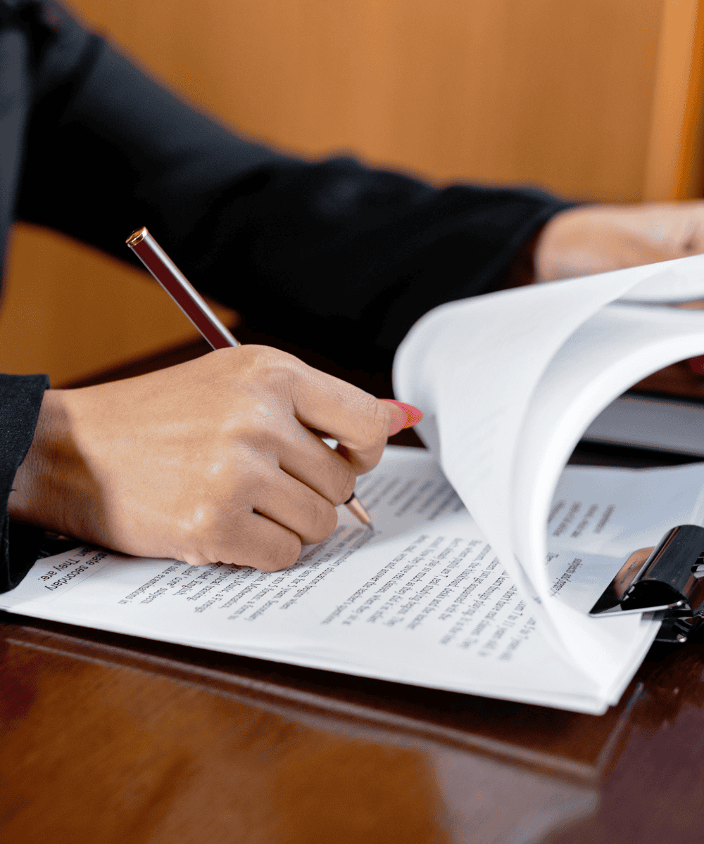 Attorney reviewing and signing estate planning documents