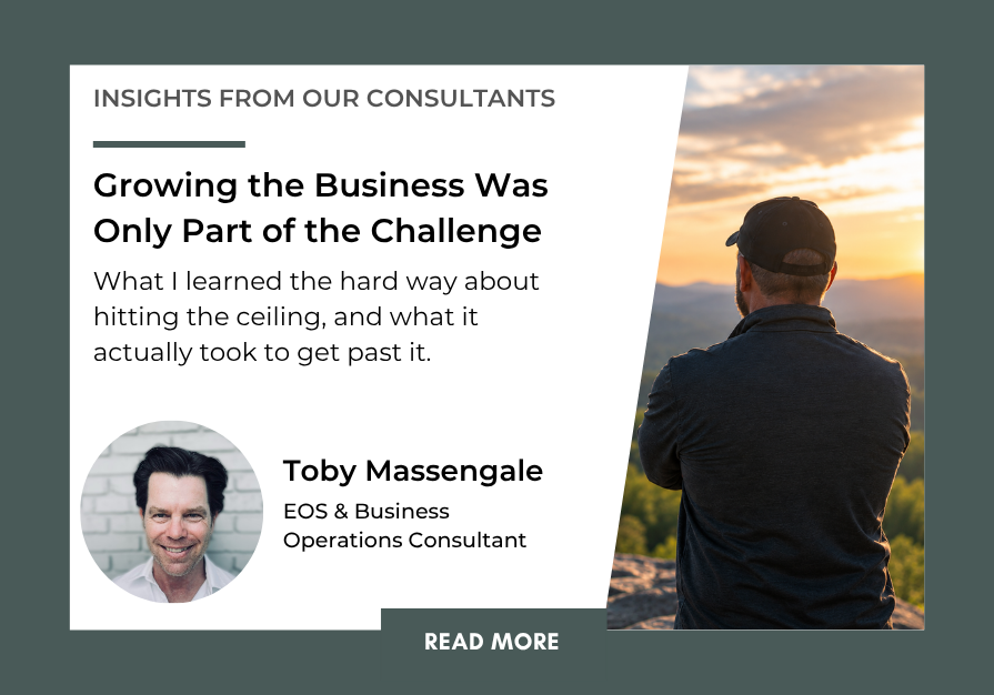Business owner overlooking a mountain landscape, representing the challenges of growing and scaling a business.
