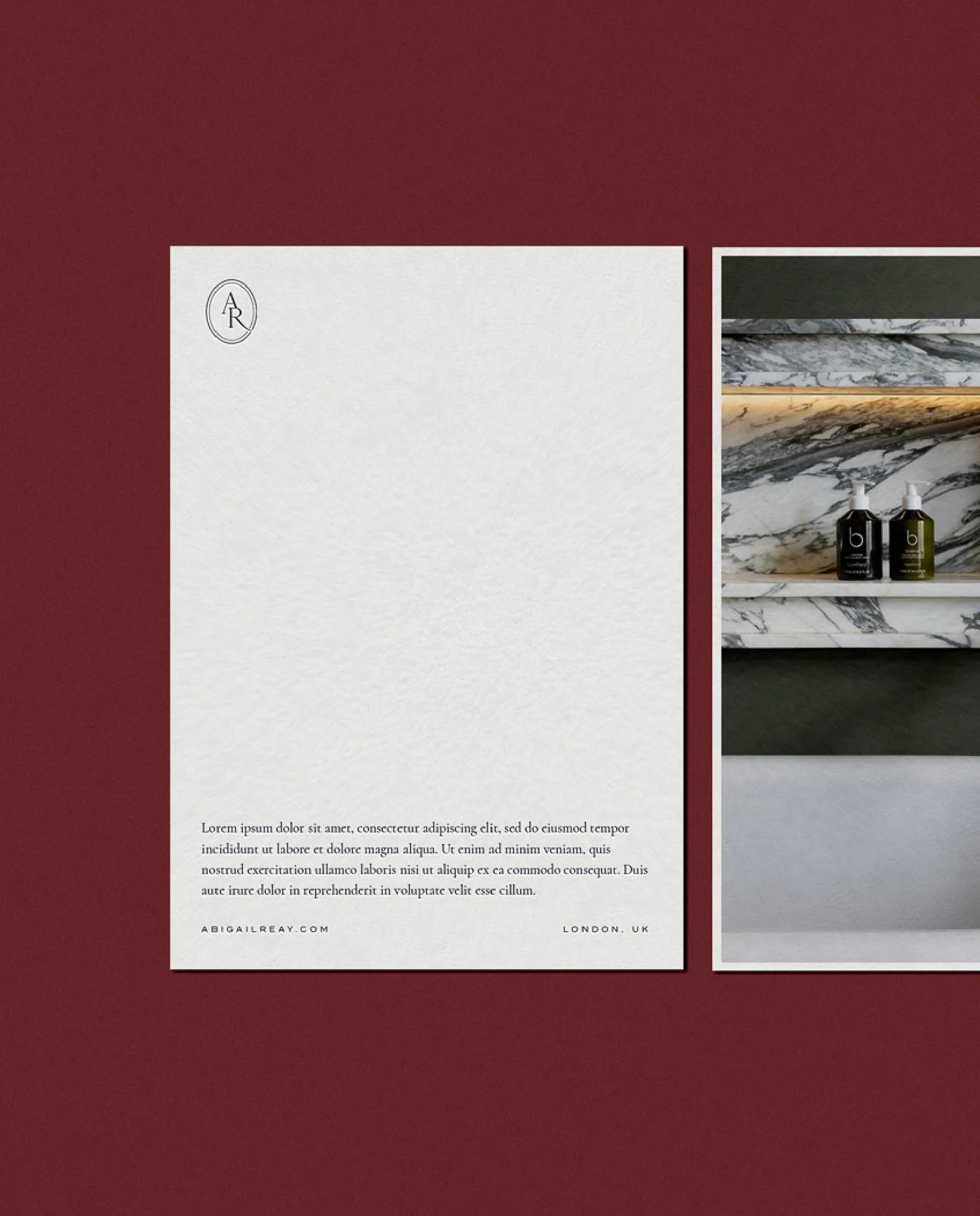 Branded stationery with Latin placeholder text next to a photograph of luxury marble shelving and bespoke bath products