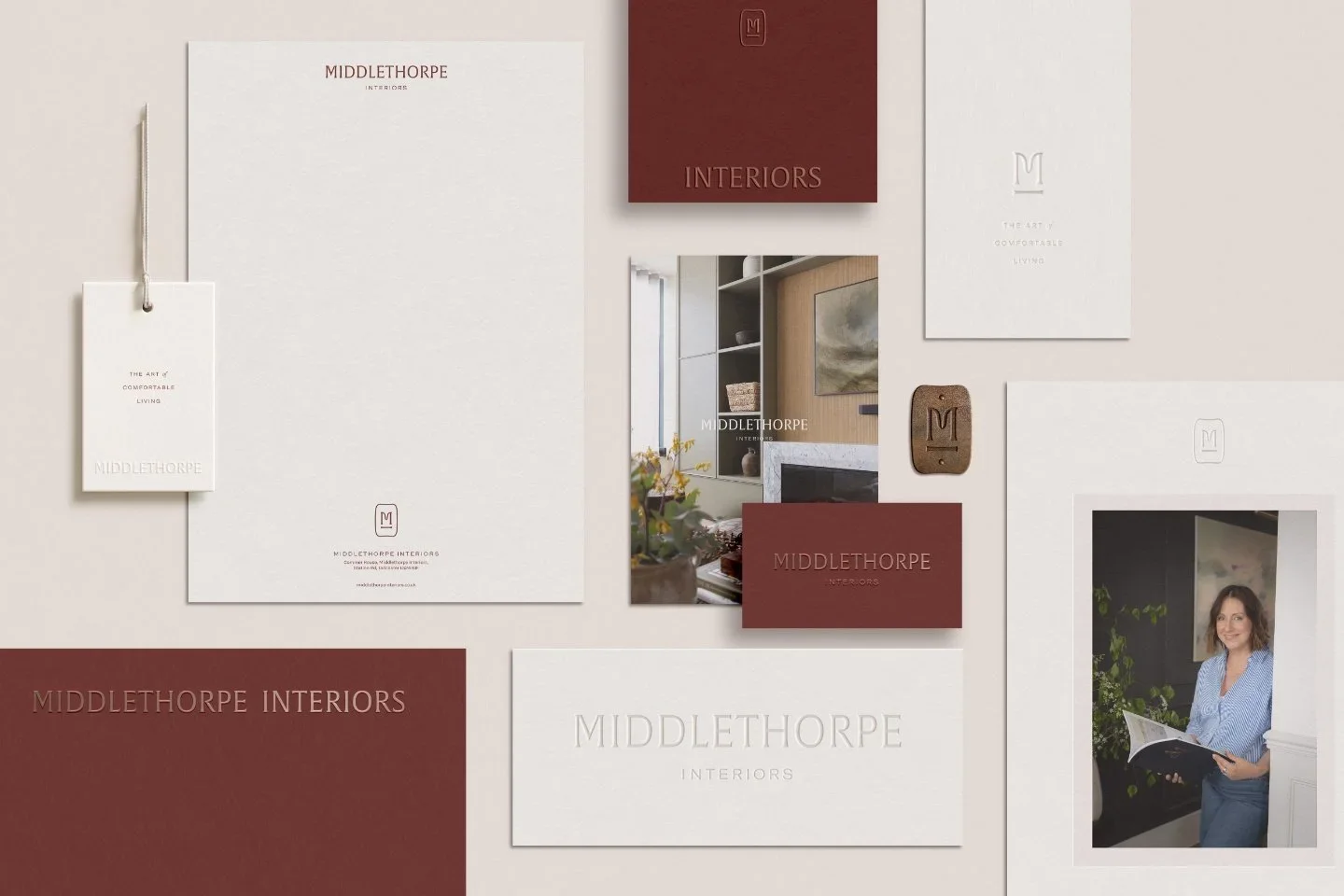 Middlethorpe Interiors brand identity kit with burgundy business cards plus white letterheads and a designer photo mockup