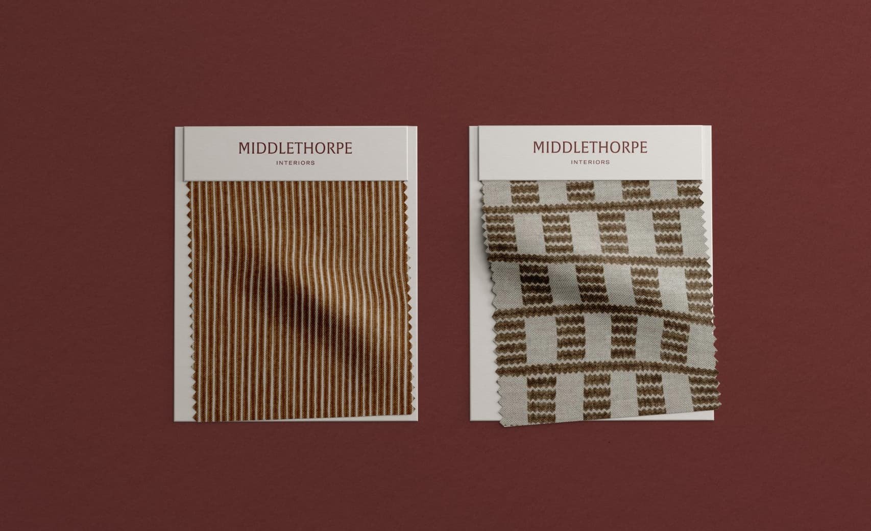 Two fabric swatches, one tan striped and one patterned, with Middlethorpe Interiors branding headers on a burgundy background