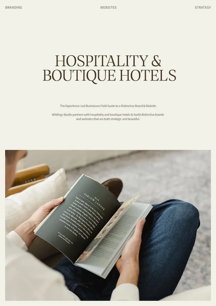 Person sitting on a sofa and reading a boutique hotel brand book titled Farlow Larder to build a strategic guest experience