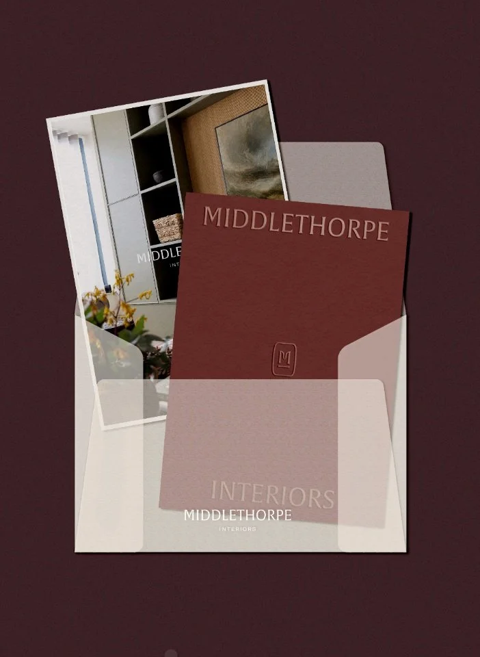 Interior design with landscape art above a fireplace plus white tulips and a neutral palette for Middlethorpe Interiors