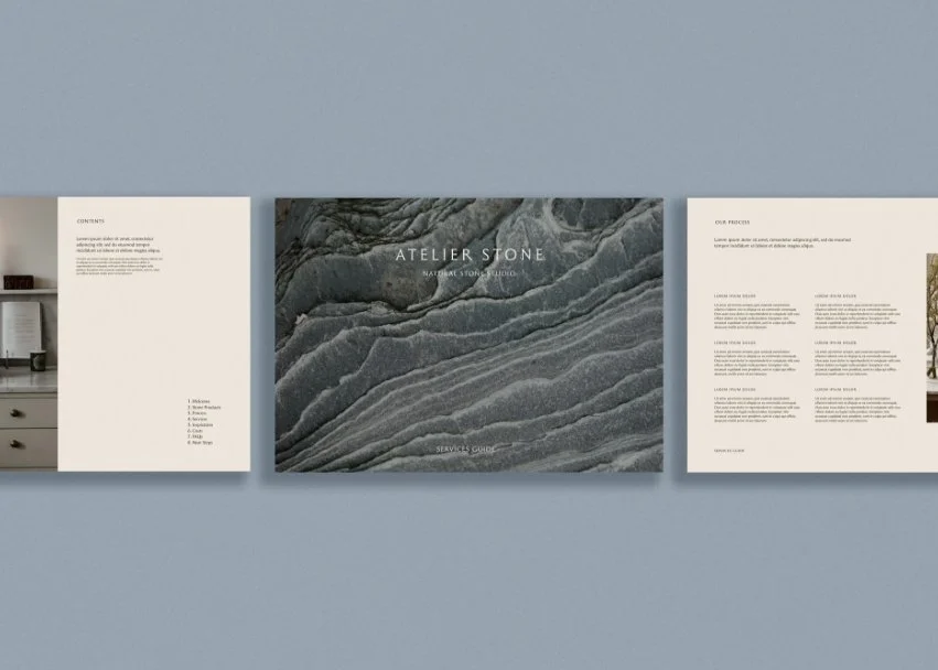 Open pages of the Atelier Stone services guide showing a textured stone cover a contents page and the stone making process