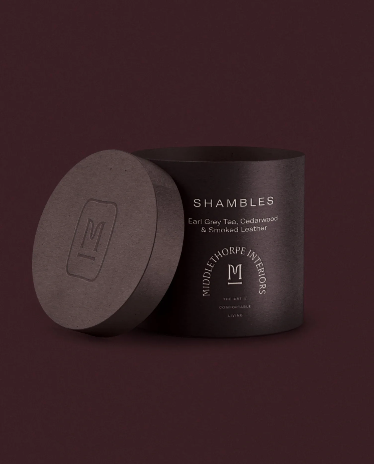 Custom round candle box packaging for Shambles signature scent concept by Middlethorpe Interiors luxury studio in York