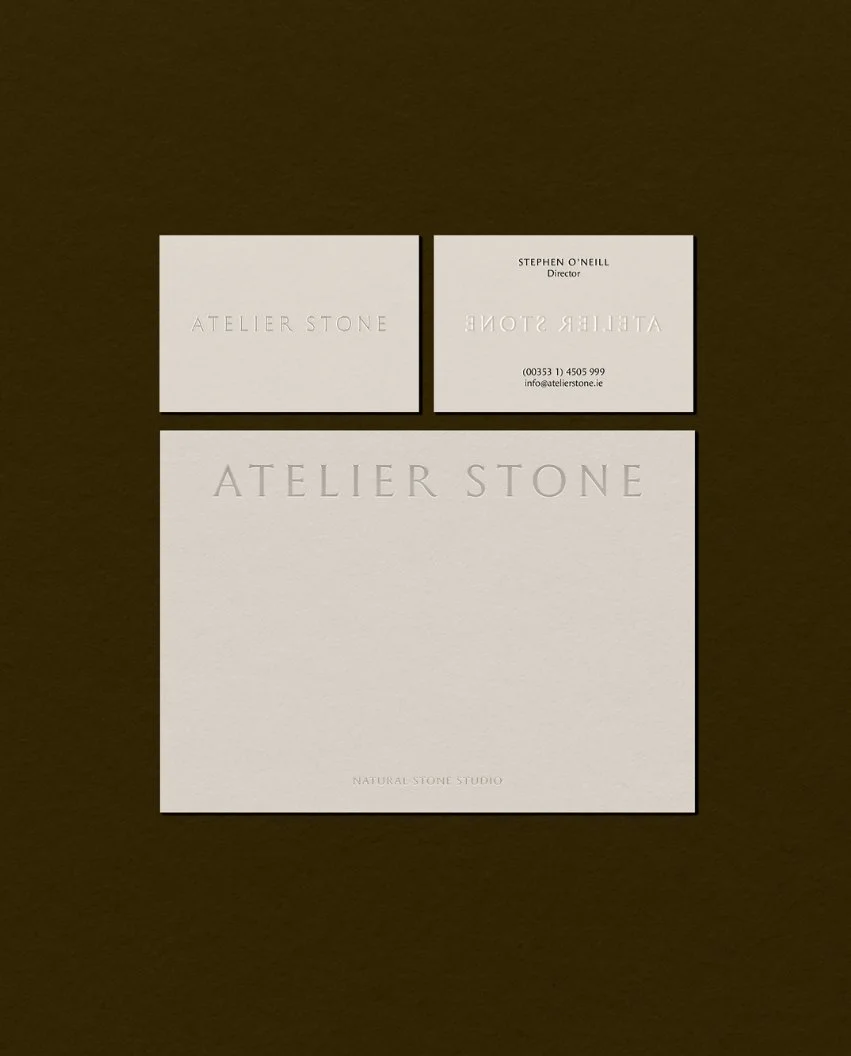 Debossed business cards and a postcard for Atelier Stone Natural Stone Studio including contact details for the director