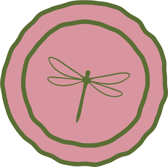 A pink circular design with a green outline, featuring a simple green dragonfly illustration in the center.