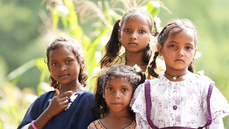 four girls standing outside