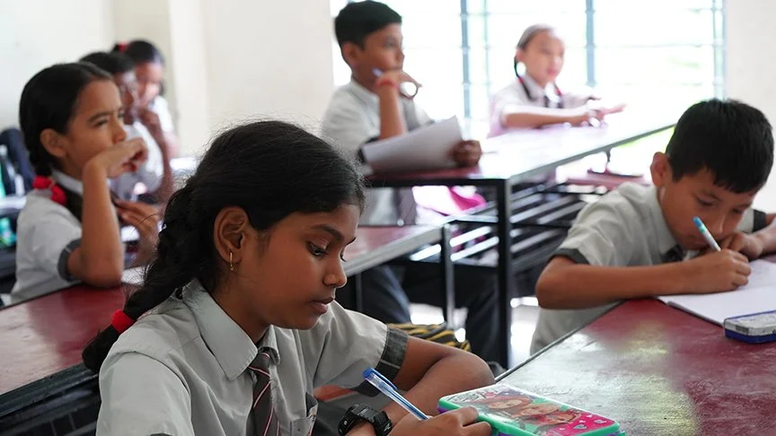 School girls in India work together in class