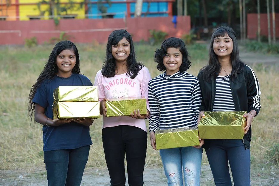 Girls with unopened gift boxes