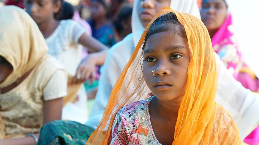 girl in yellow head scarf