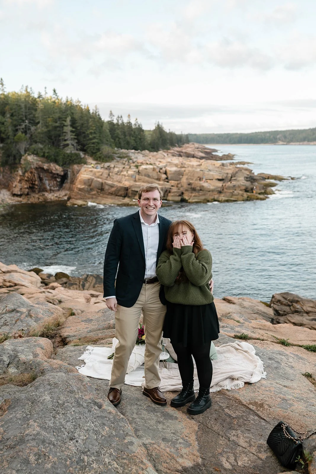 maine surprise proposal along the coast overlooking ocean