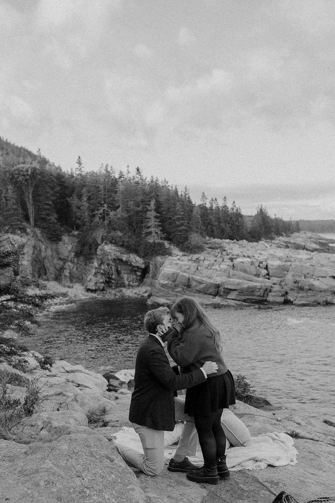 maine surprise proposal along the coast overlooking ocean