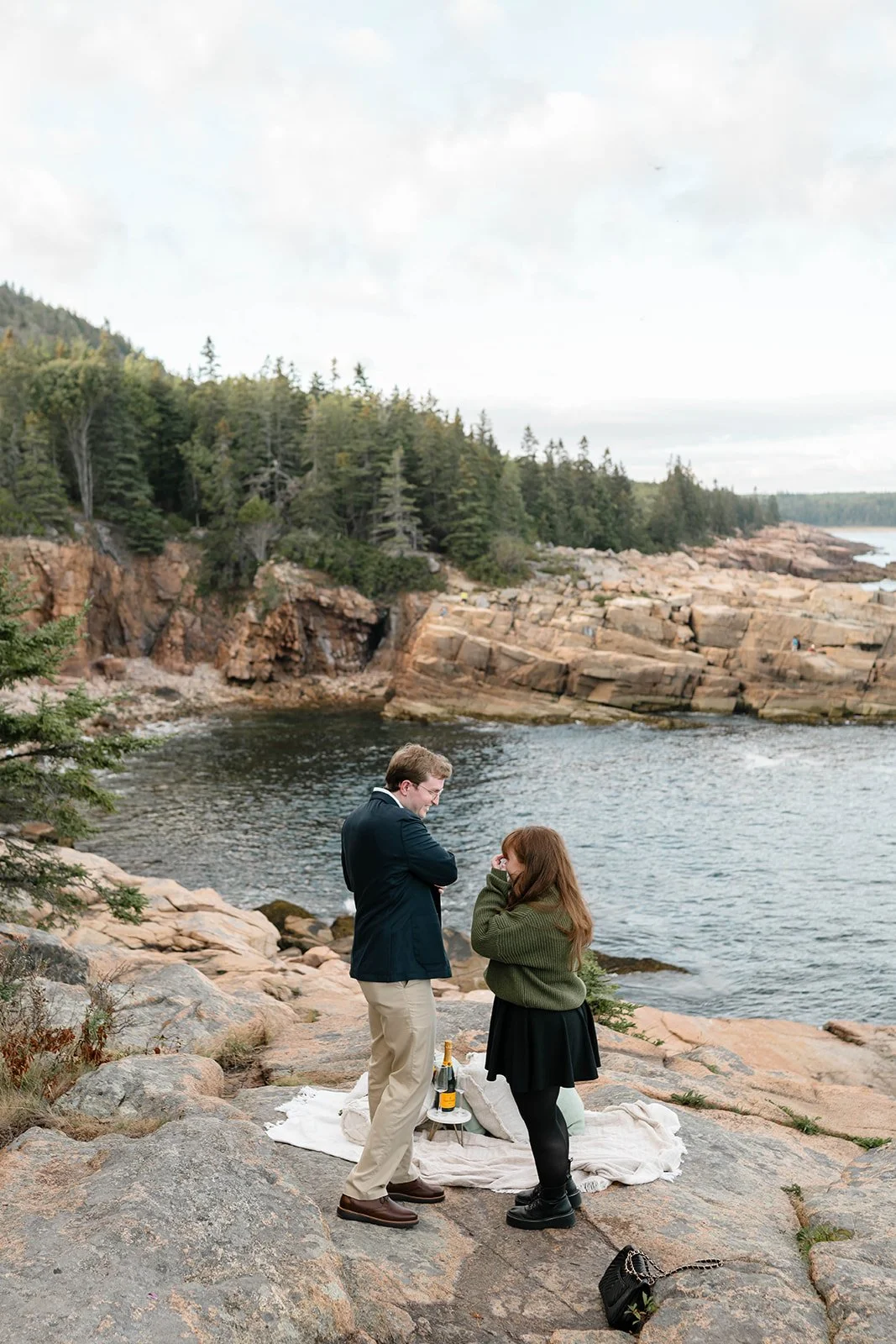 maine surprise proposal along the coast overlooking ocean