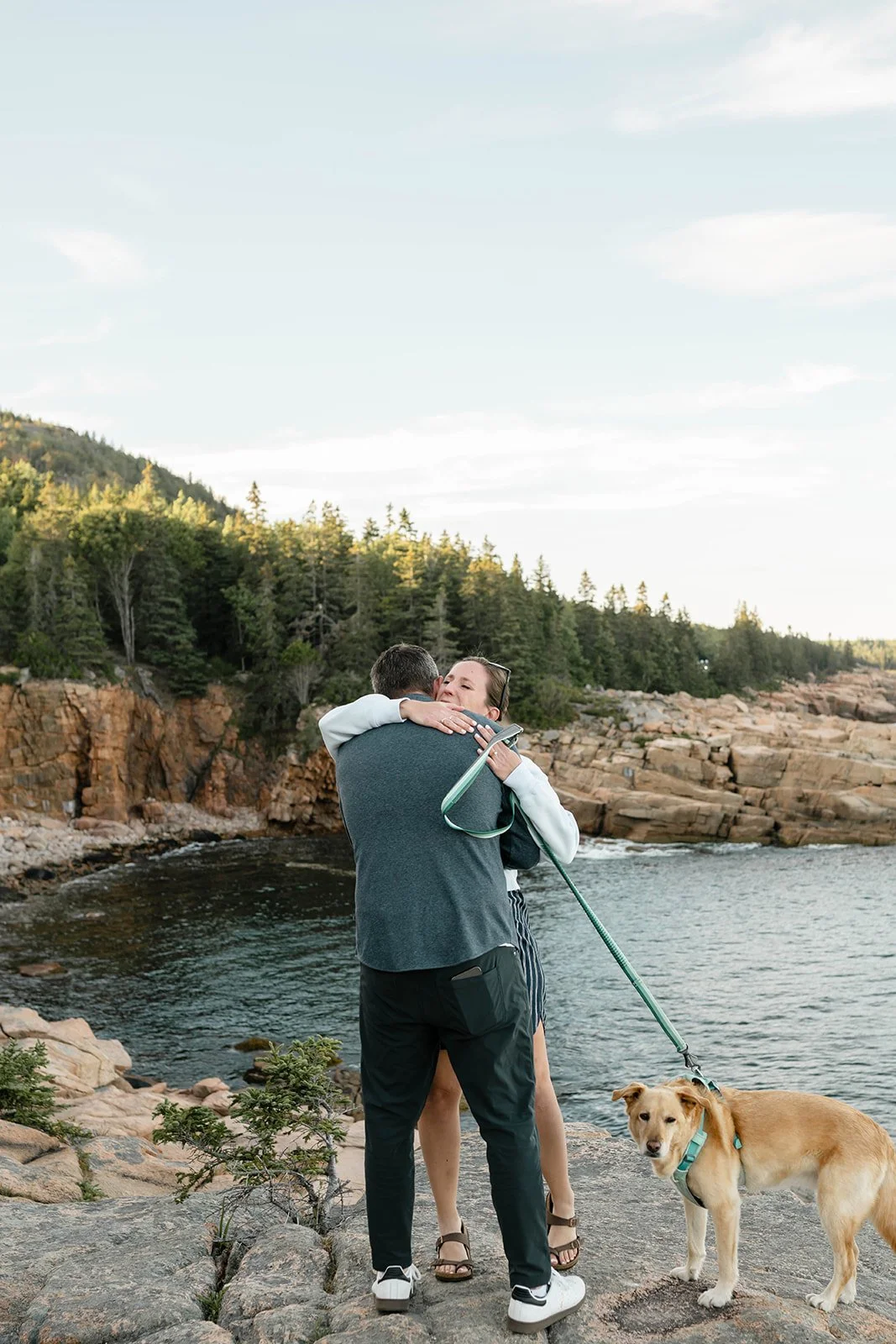 maine surprise proposal on a cliff overlooking the ocean