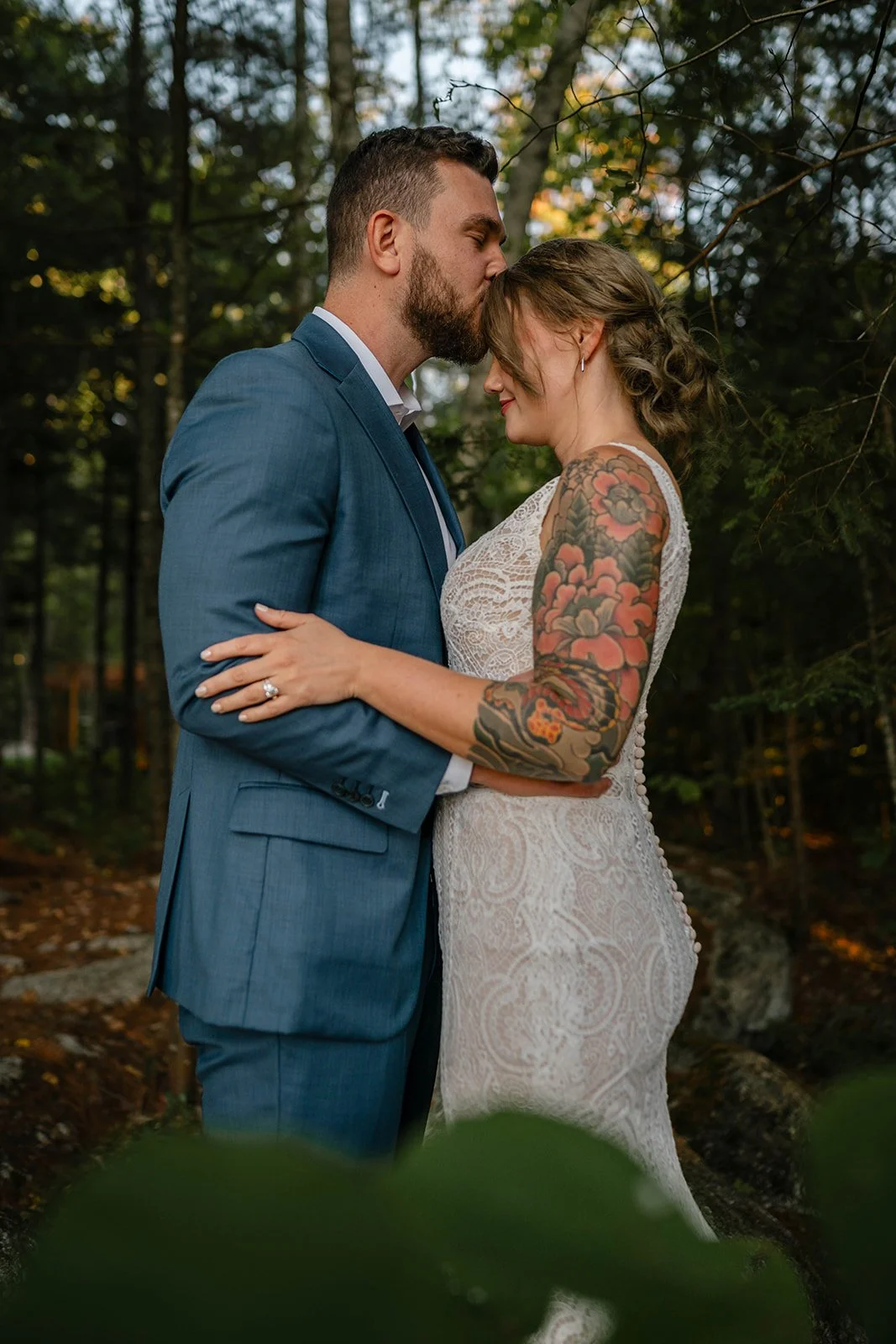 bride and groom in the forest in maine