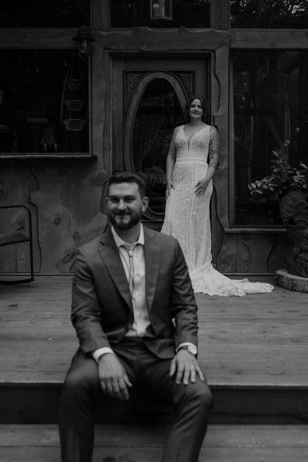 bride and groom in front of the cabin during their maine elopement