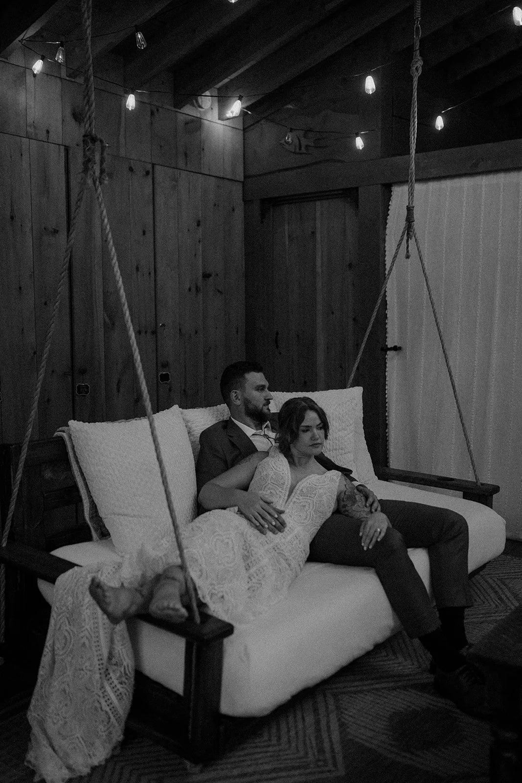 bride and groom in front of the cabin during their maine elopement