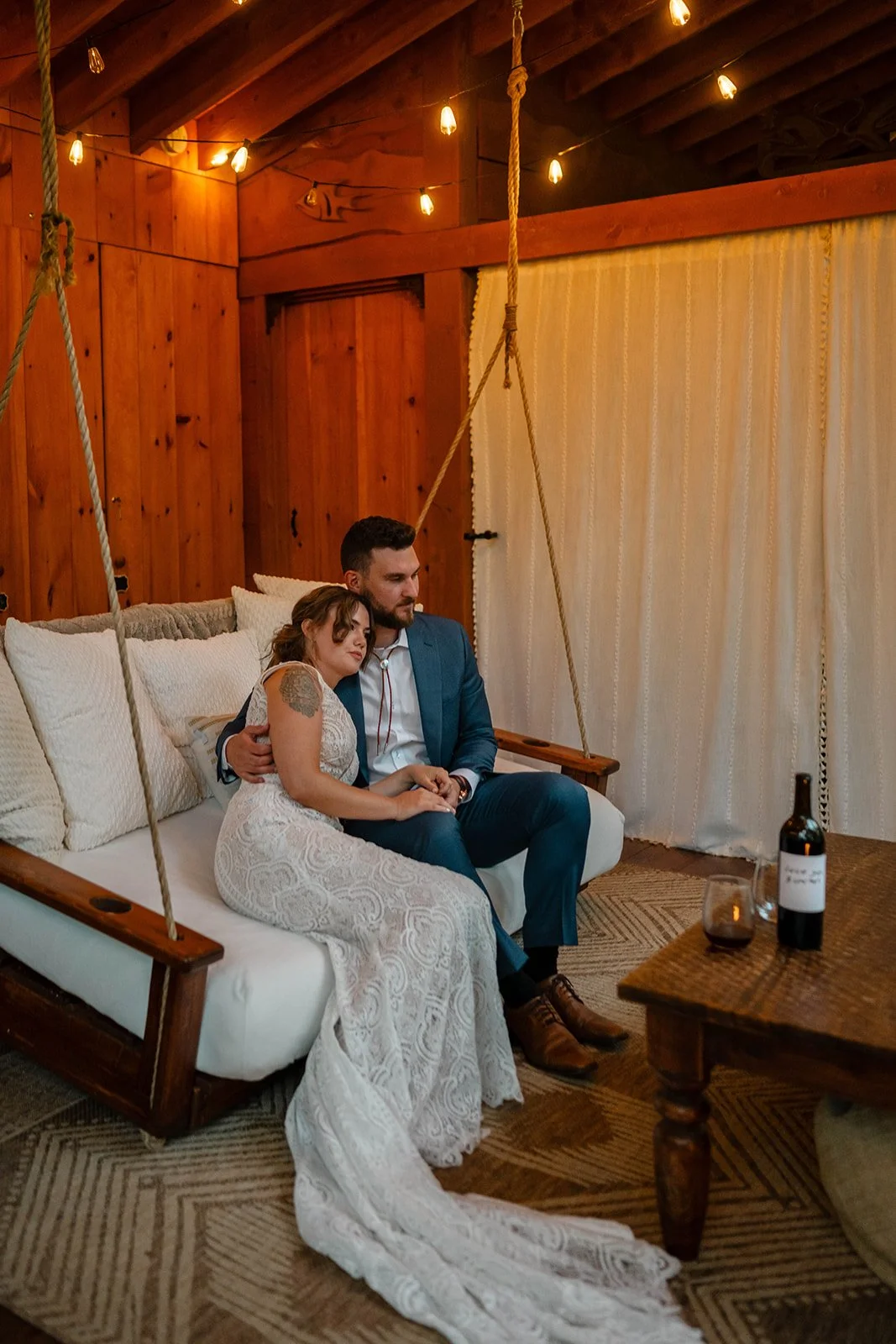 bride and groom in front of the cabin during their maine elopement