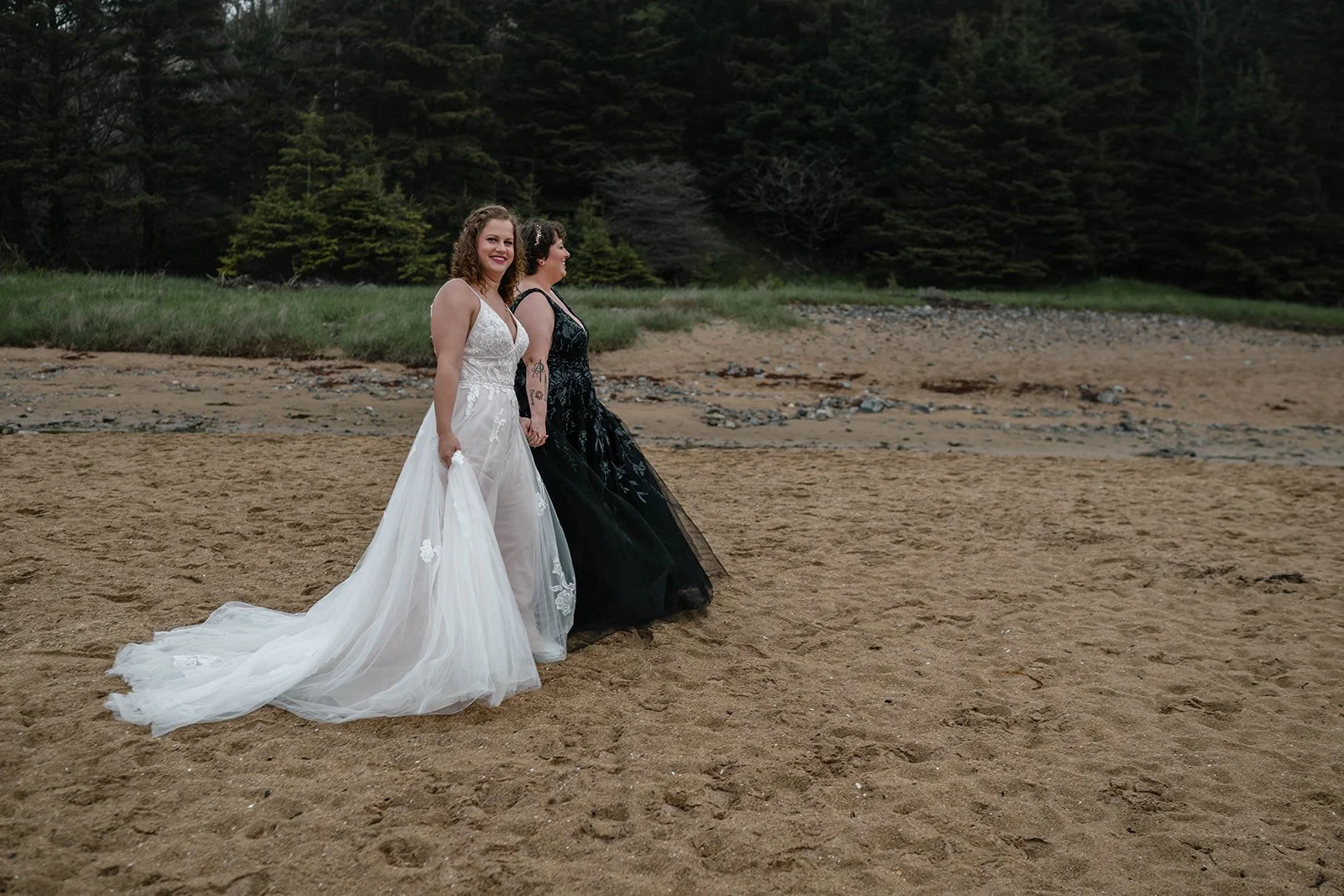 playful lesbian coastal elopement photos at sand beach in acadia national park