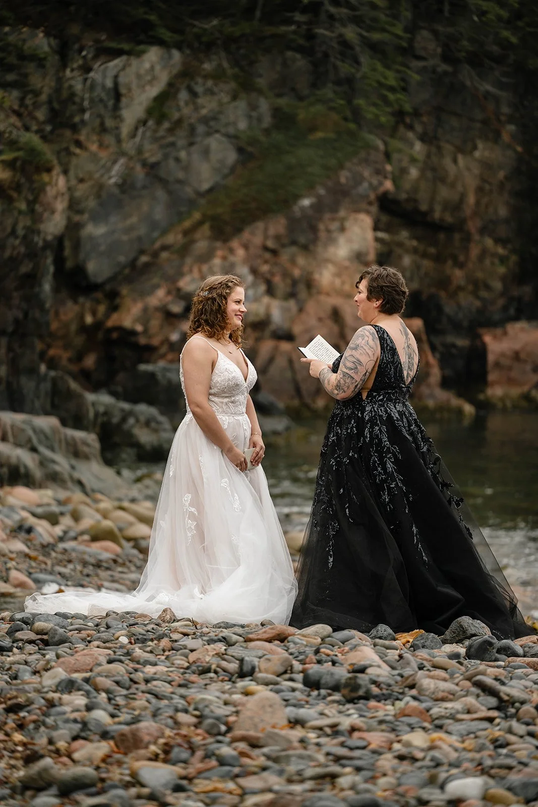 brides exchanging vows at hunter's beach in acadia national park
