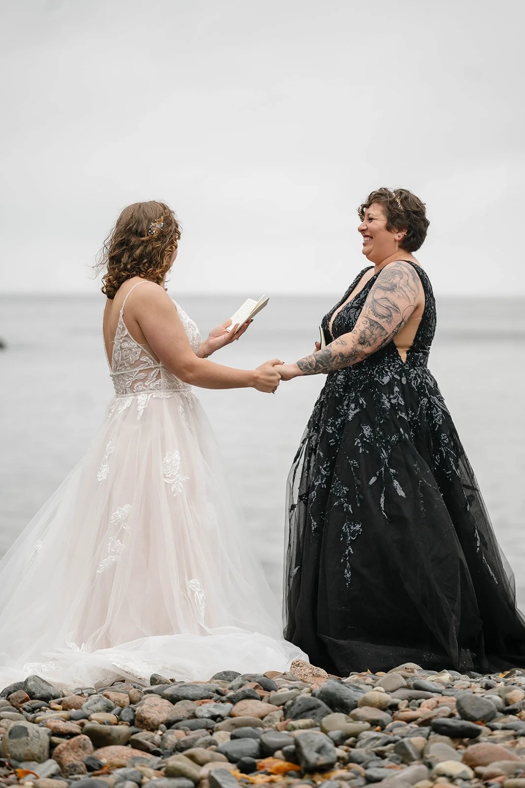 brides exchanging vows at hunter's beach in acadia national park