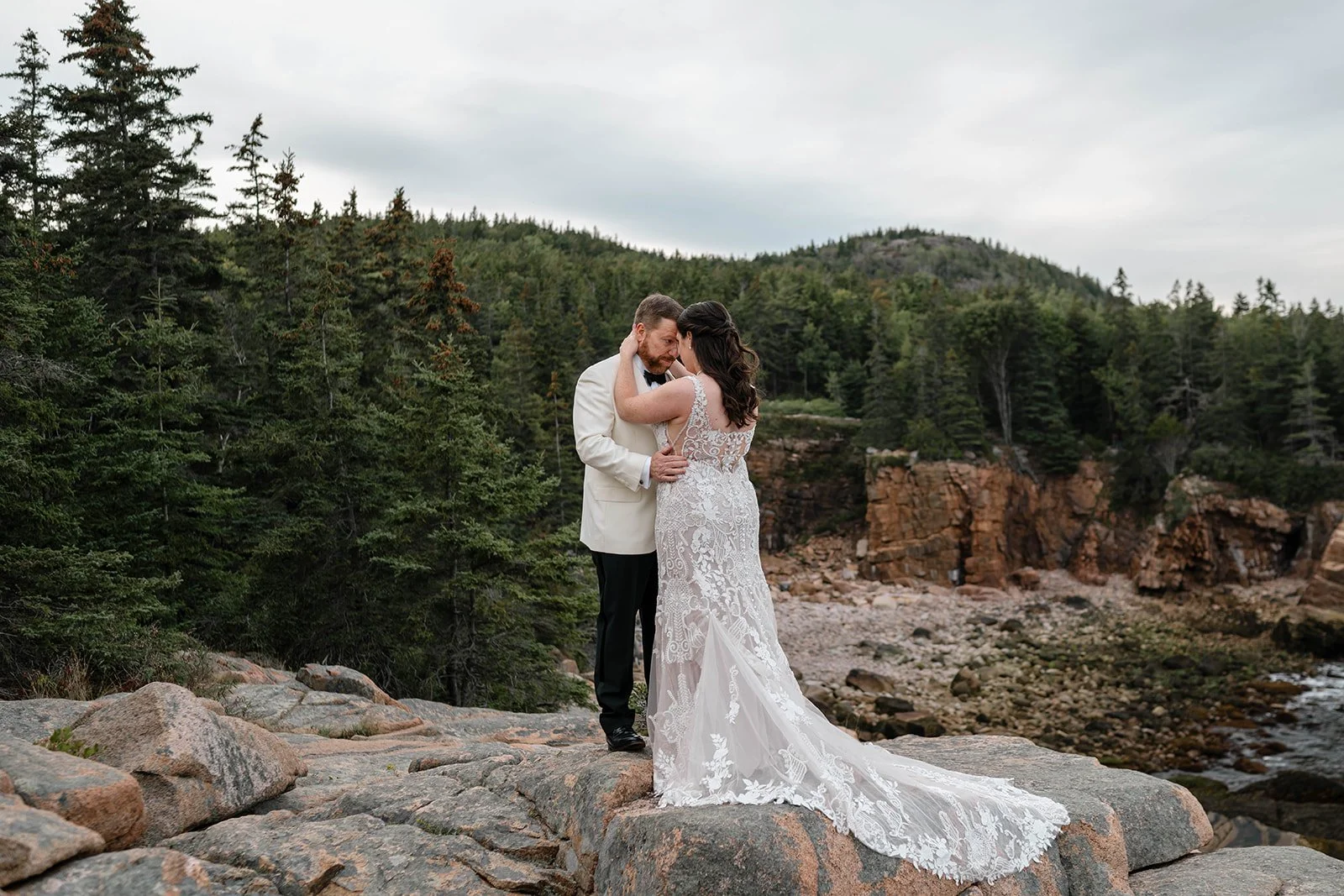 sweet elopement couple on a rocky overlook during their acadia, maine elopement