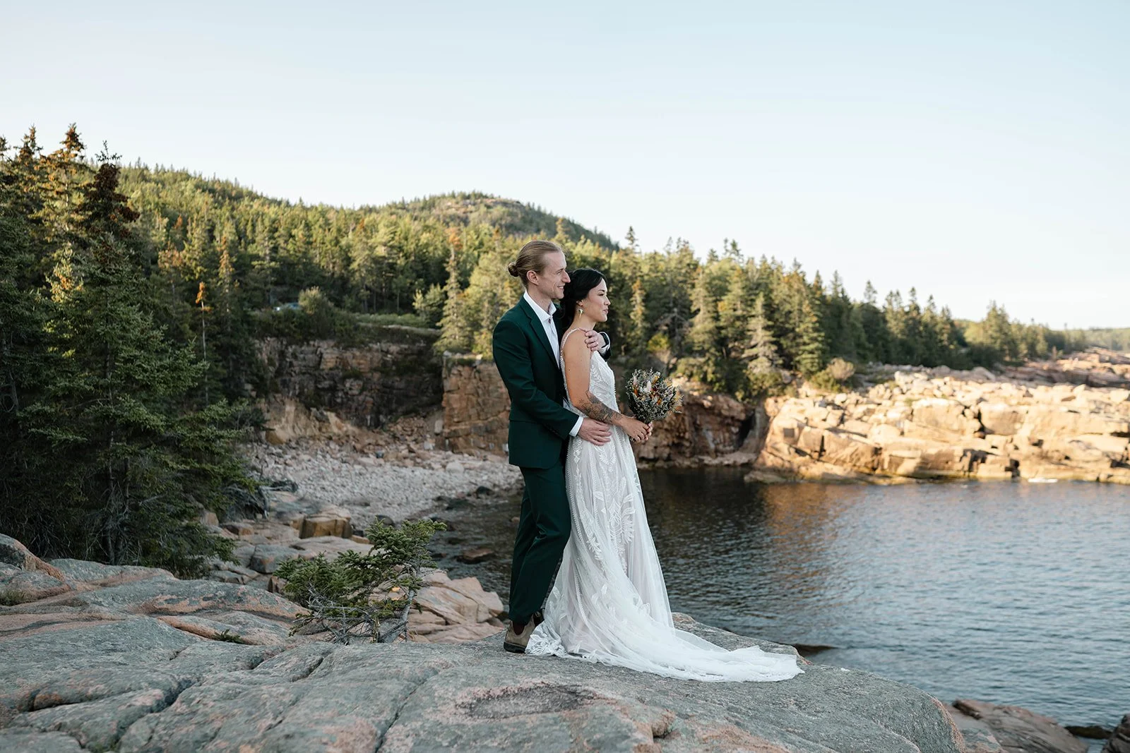 bride and groom gazing upon the ocean during their acadia national park elopement