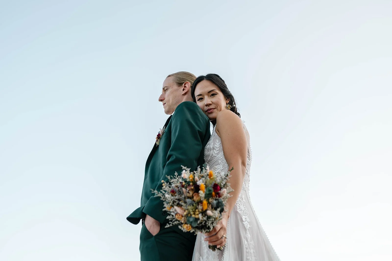 elopement couple standing on coastal cliffs during their acadia elopement