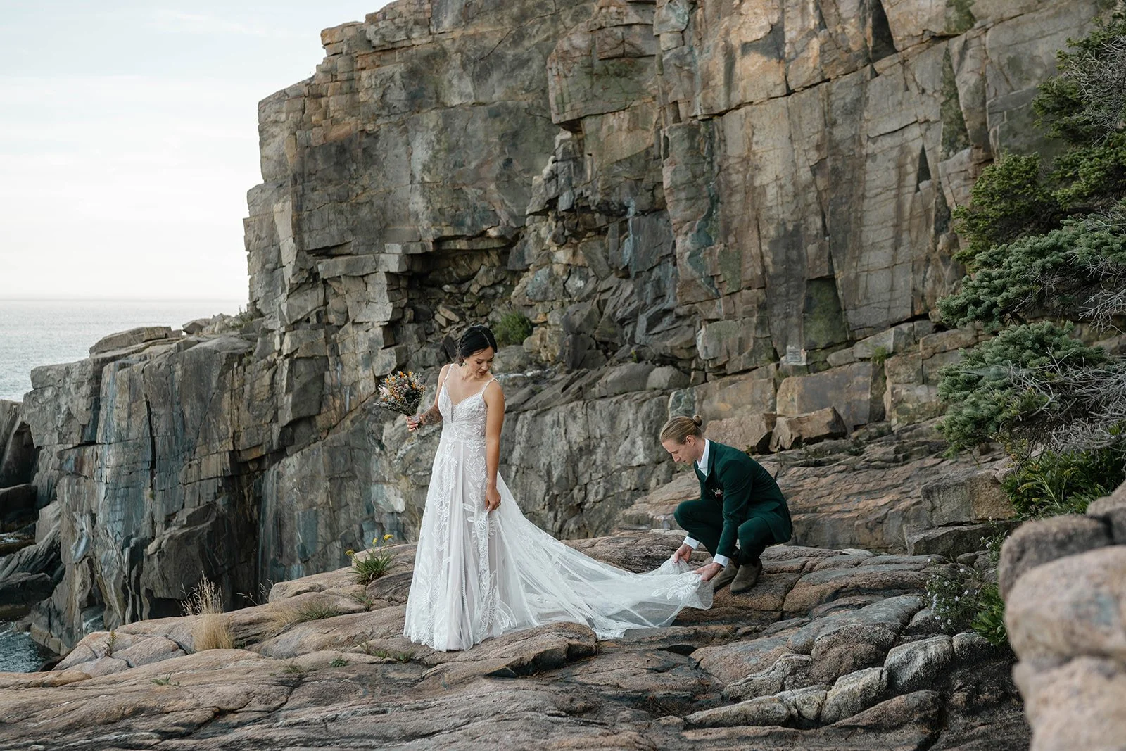 elopement couple standing on coastal cliffs during their acadia elopement