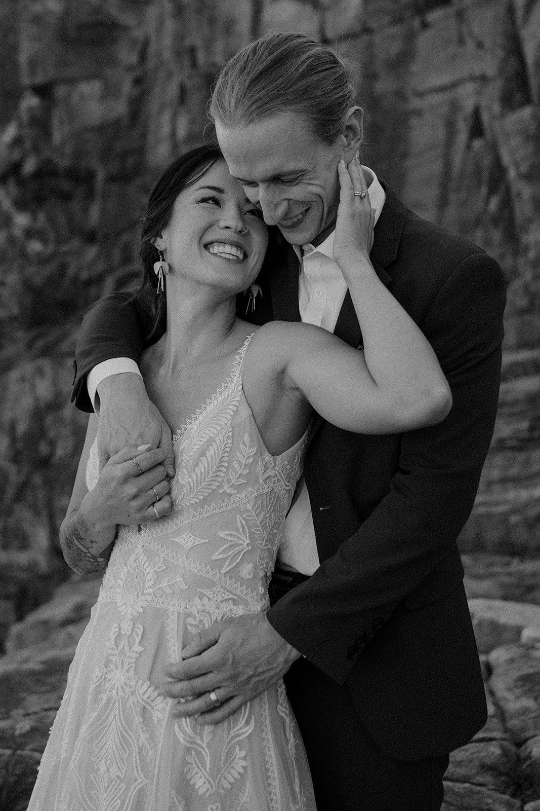 snuggly elopement couple at otter cliff overlook in acadia national park
